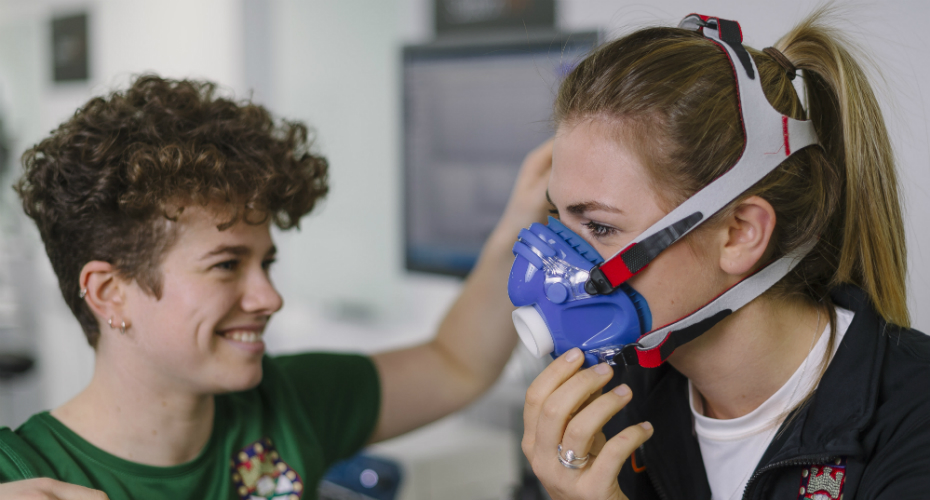 Sports and health science students using breathing technology